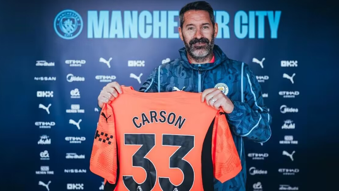 Man City official: extends 38-year-old goalkeeper Carson's contract by one year, new deal until summer 2025